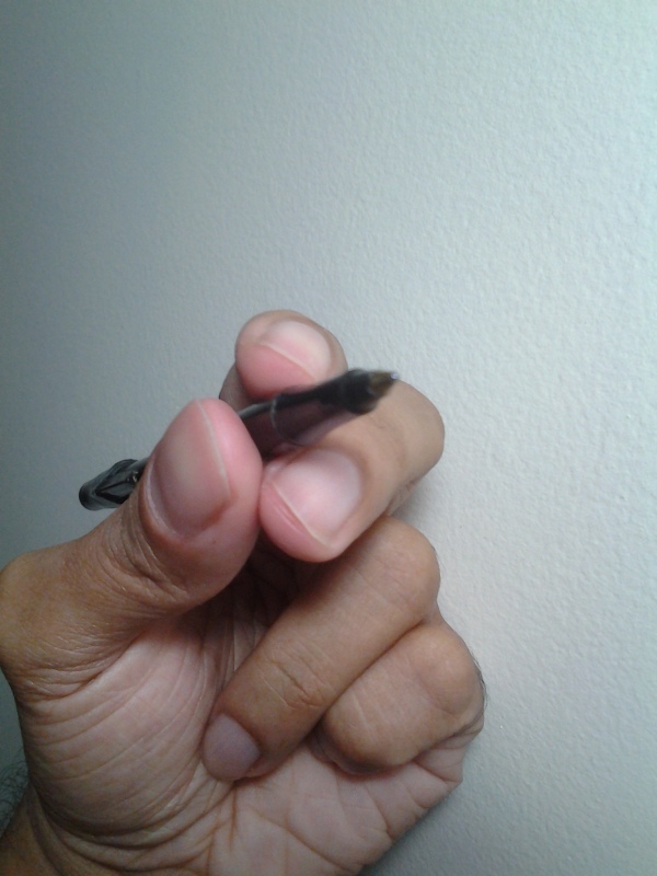 While the middle finger creates the "shelf" to hold the pen, the ring finger, little finger and the base of the thumb create the "pad" the hand rests on.